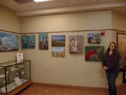 The artist with her paintings at the Wheatfield Library