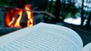 book with campfire in background