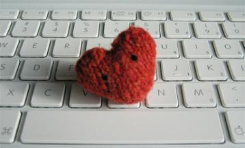 photo of a knitted heart on a keyboard